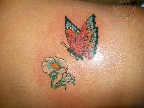 Flower And Flying Butterfly Tattoo On Lowerback